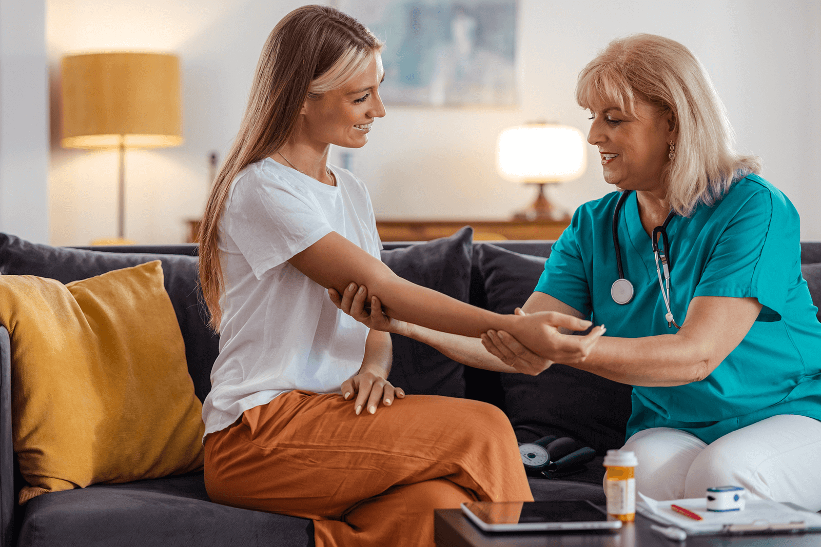 internal medicine doctor holding her patient's hand